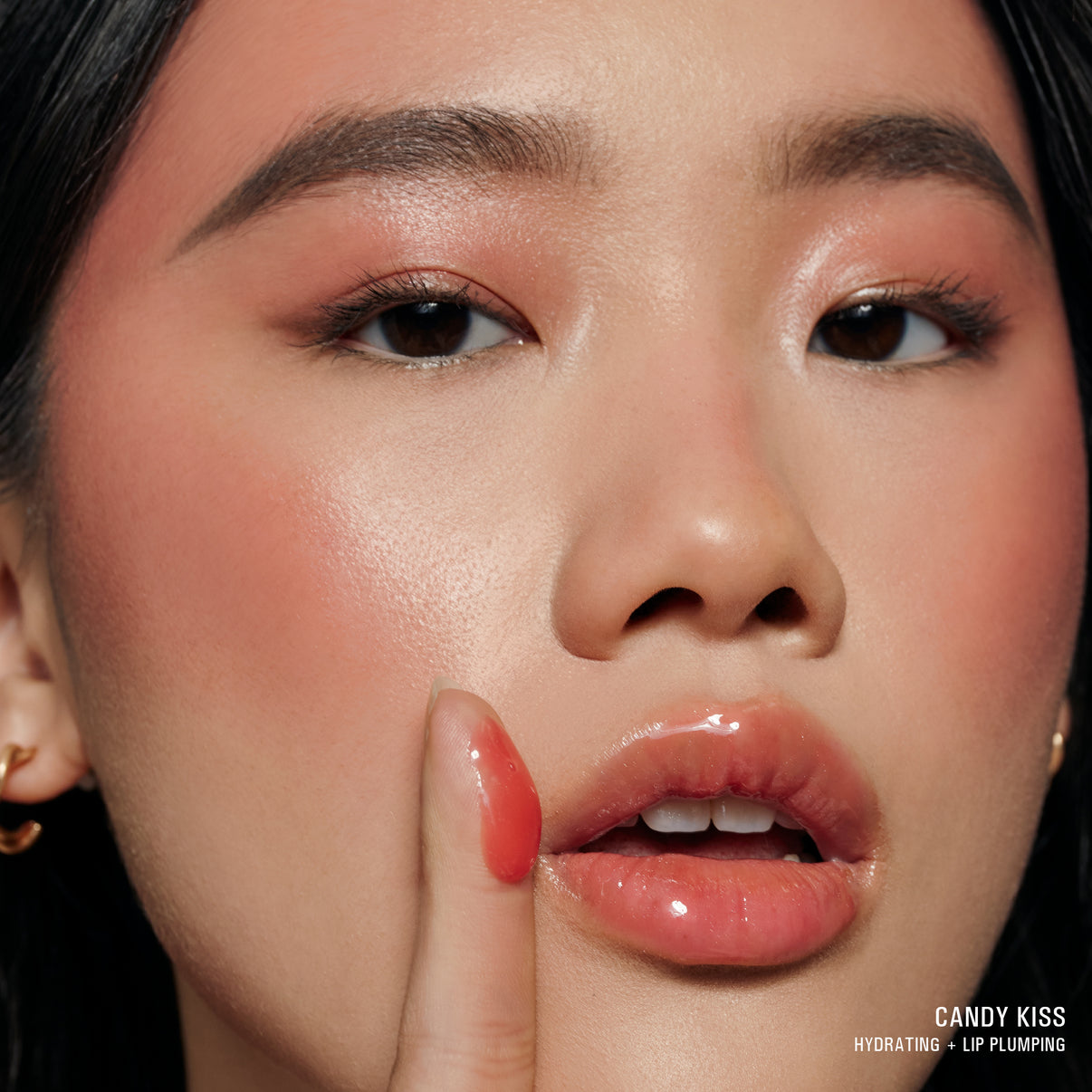CANDY KISS Hydrating Peptide Lip Butter swatch on model lips and finger