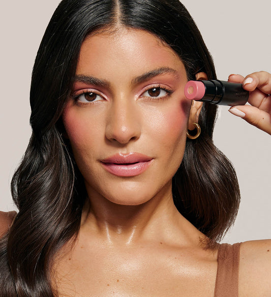 model holding nudies matte + glow core